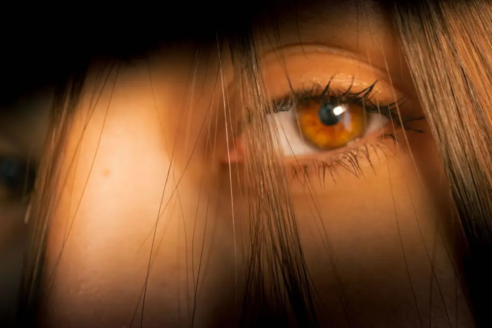 A close-up of an eye with a bright catchlight